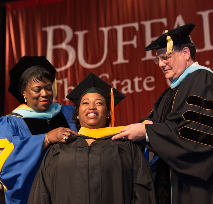 Graduate Commencement student on stage