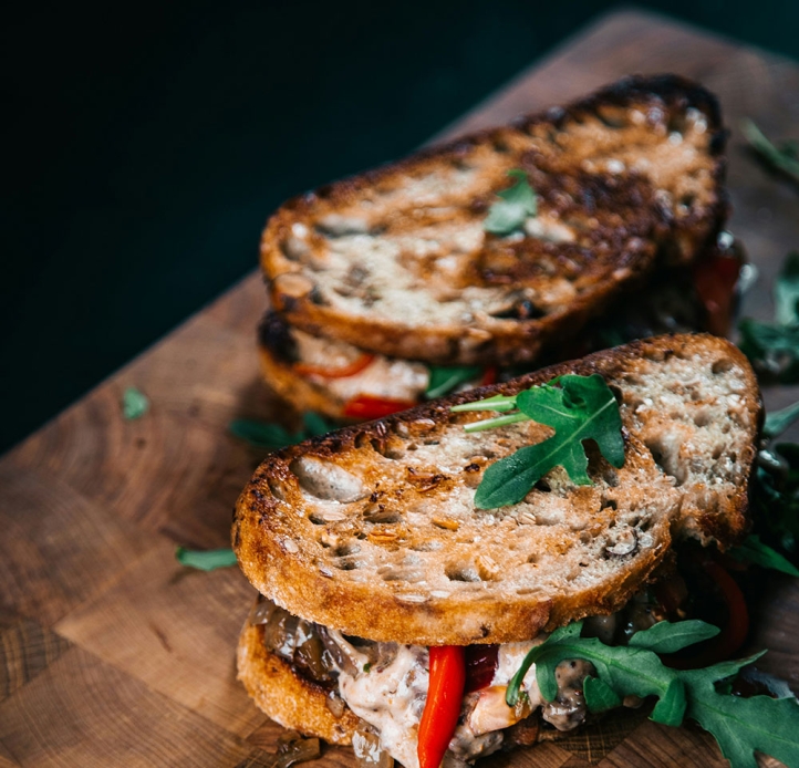 Two sandwiches on a board