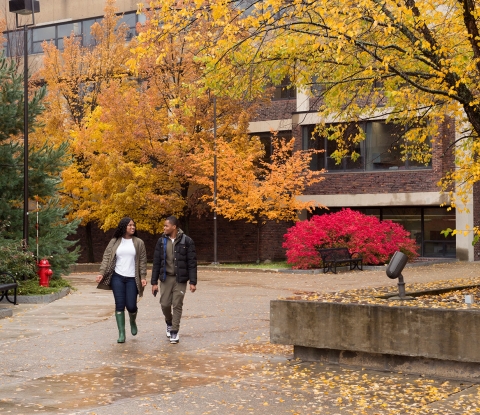 Fall campus quad with two students