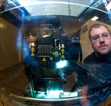 Engineering student using equipment